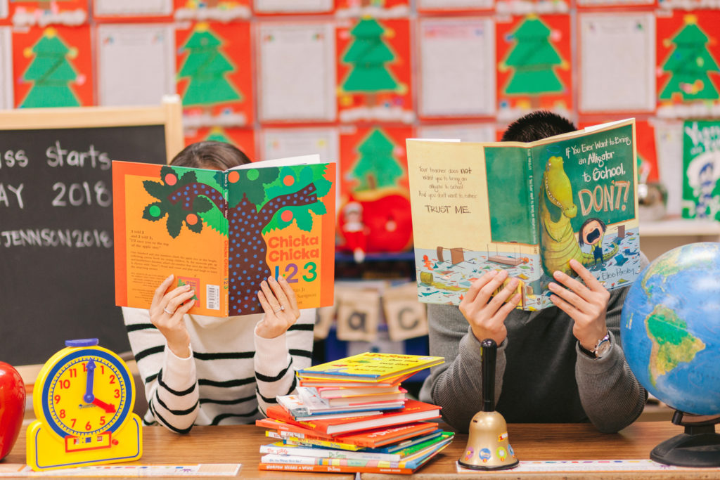 couple reading books classroom