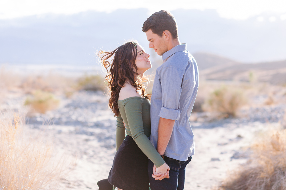 indio desert engagement holding hands