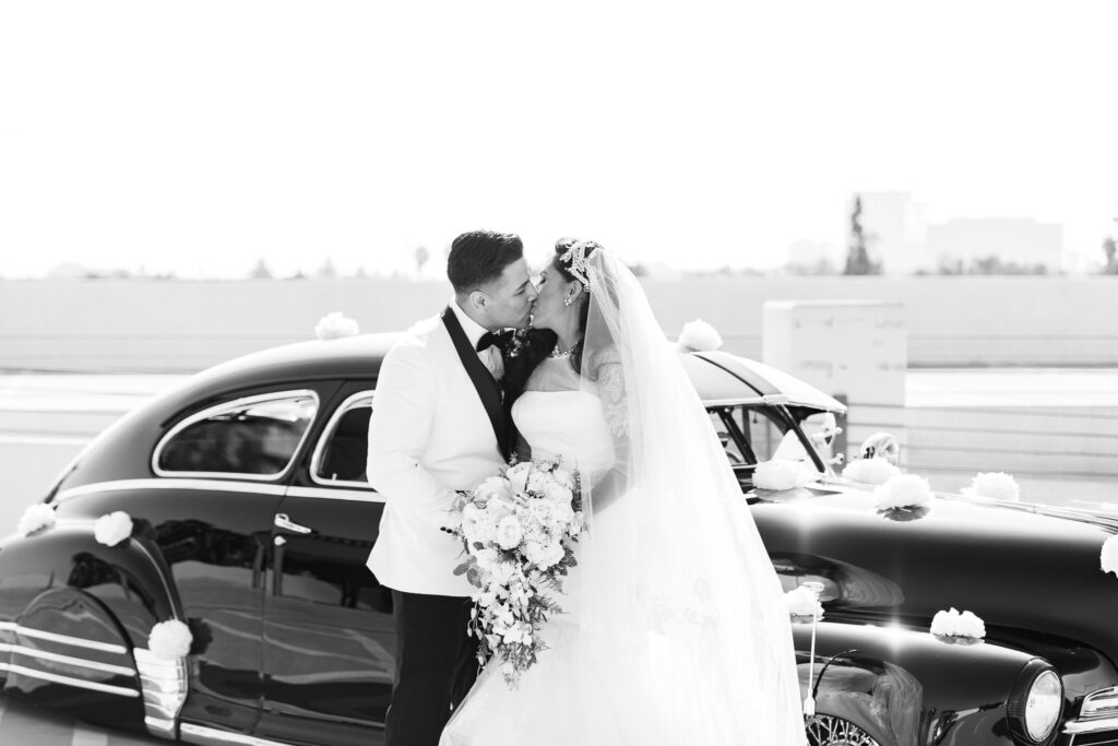 vintage wedding couple with car