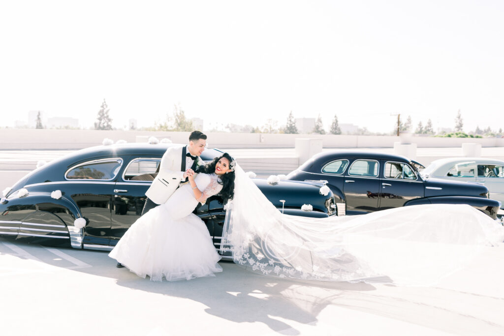 vintage wedding couple with car