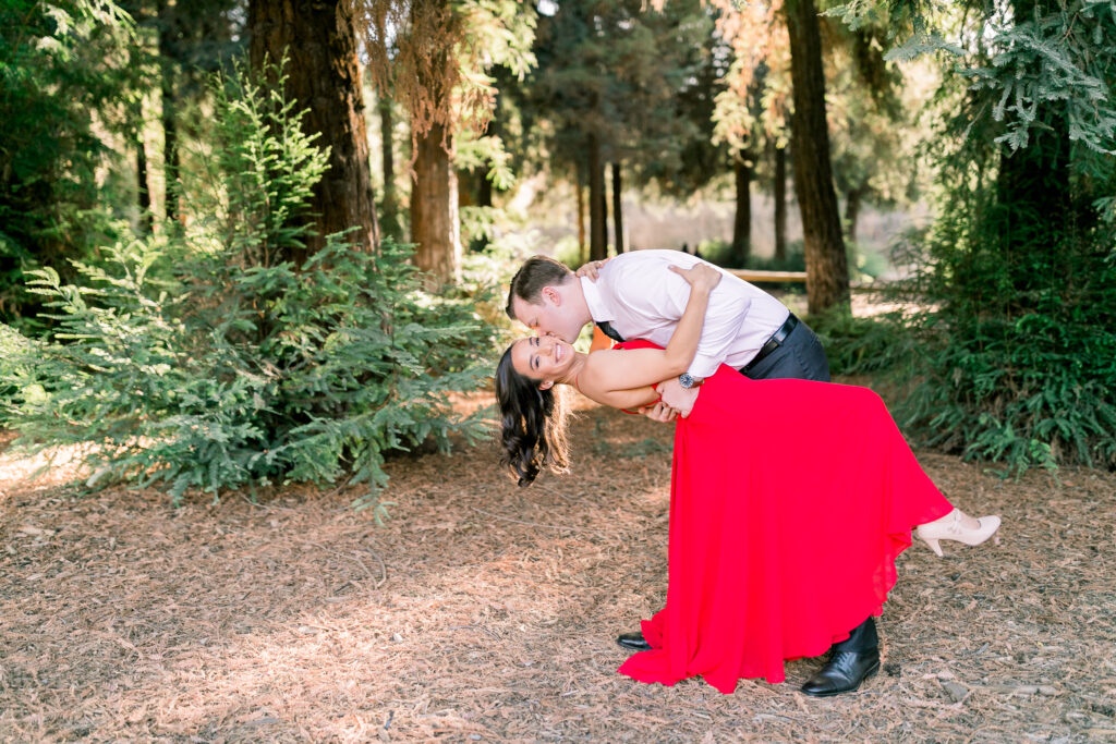 lush forest engagement couple red dress