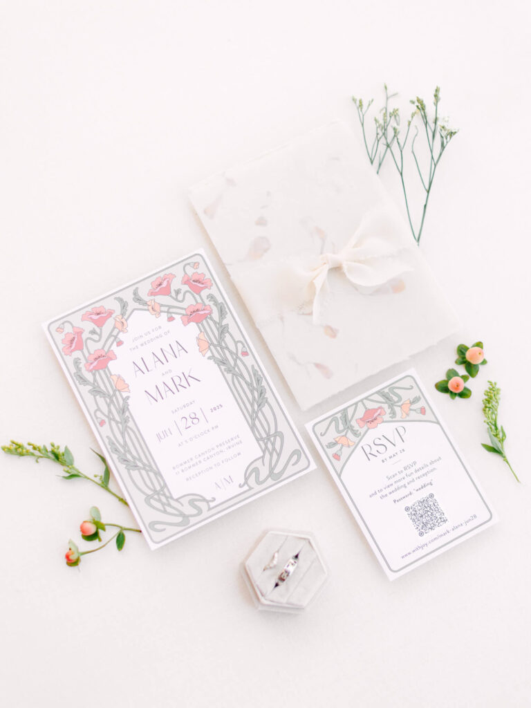 Wedding stationery set with floral designs, including an invitation and RSVP card.